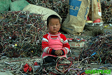 a-chinese-child-sits-amongst-a a-chinese-child-sits-amongst-a